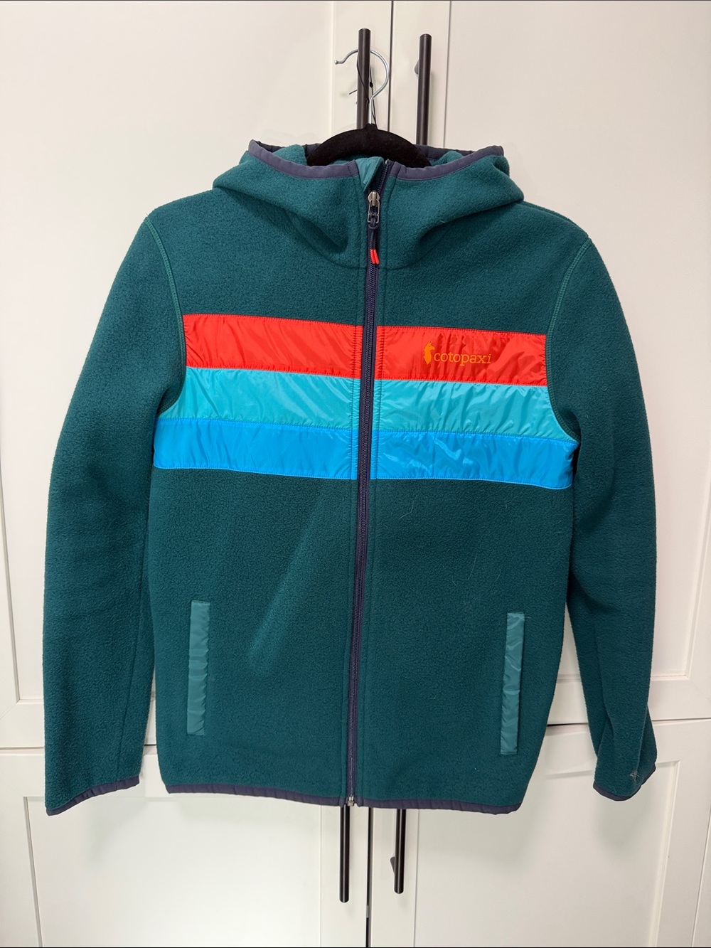 Cotopaxi Men’s Teal Hooded Jacket with Red and Blue Stripes (XS)